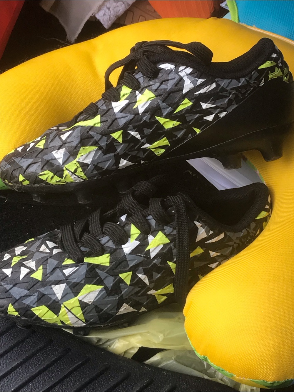Dream Pairs Kids Black Soccer Cleats with Neon Yellow and White Triangle Pattern